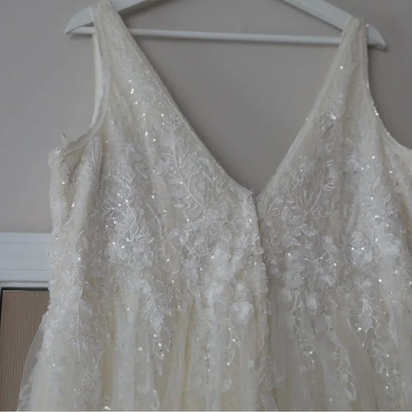This wedding dress is a size 20. Brand New and had never been worn before.